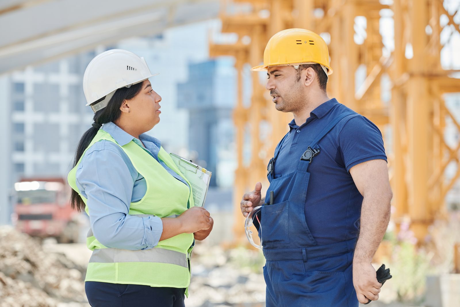 Construction team in hard hats and safety vests